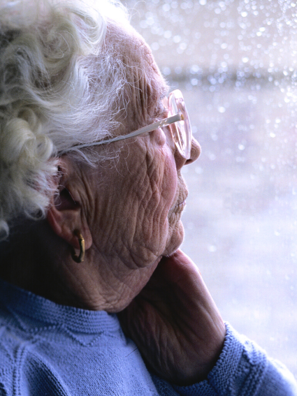 Seasonal Affective Disorder - Elderly Woman Looking Out Window