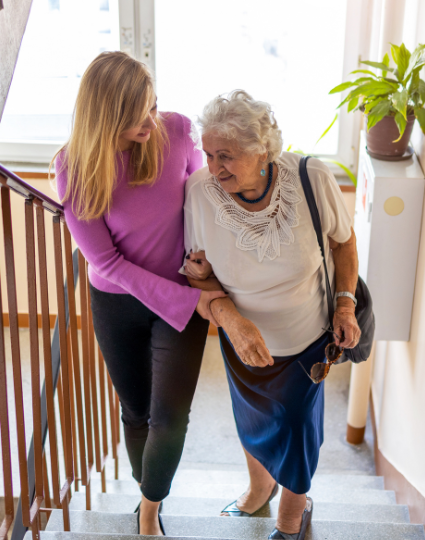 New Caregiver Assisting Loved One on Stairs