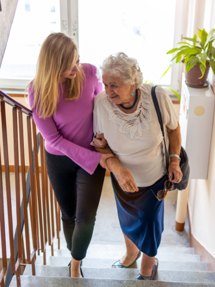 New Caregiver Assisting Loved One on Stairs