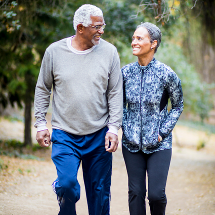 Elderly Couple Walking Along a Path