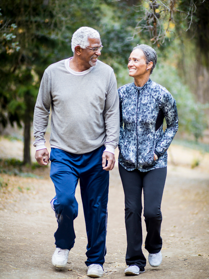 Elderly Couple Walking Along a Path