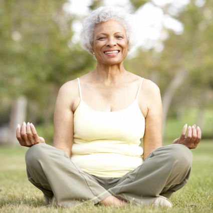 Older adult woman doing yog